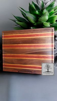 cutting board made from black walnut, maple and padauk handmade by Northern Rustic Wood