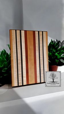 Handmade ribbon maple, padauk and wenge cutting board by Northern Rustic Wood