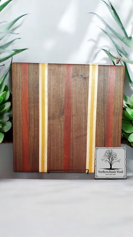handmade padauk, yellowheart and wenge cutting board by northern rustic wood