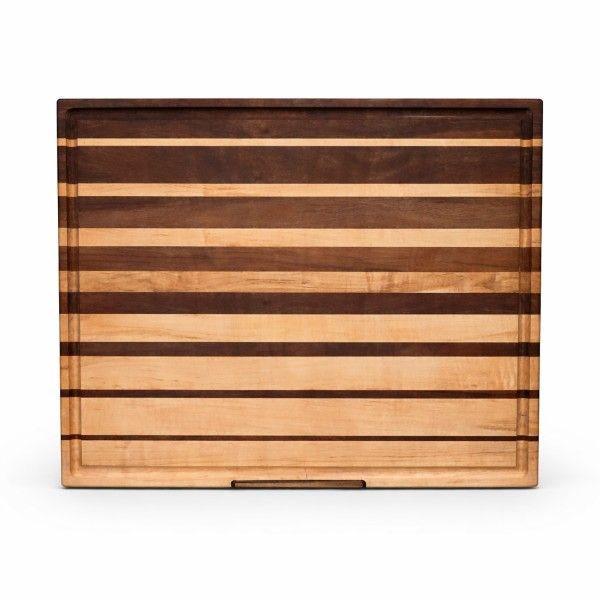 Handcrafted walnut and maple cutting board with graduated stripe pattern for kitchen food prep