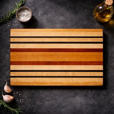 Mahogany, Ribbon Maple, Padauk, and Wenge hardwood cutting board by Northern Rustic Wood.