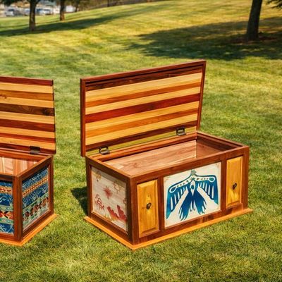 Custom hardwood blanket chest with Thunderbird-inspired design and exotic hardwood lid.
