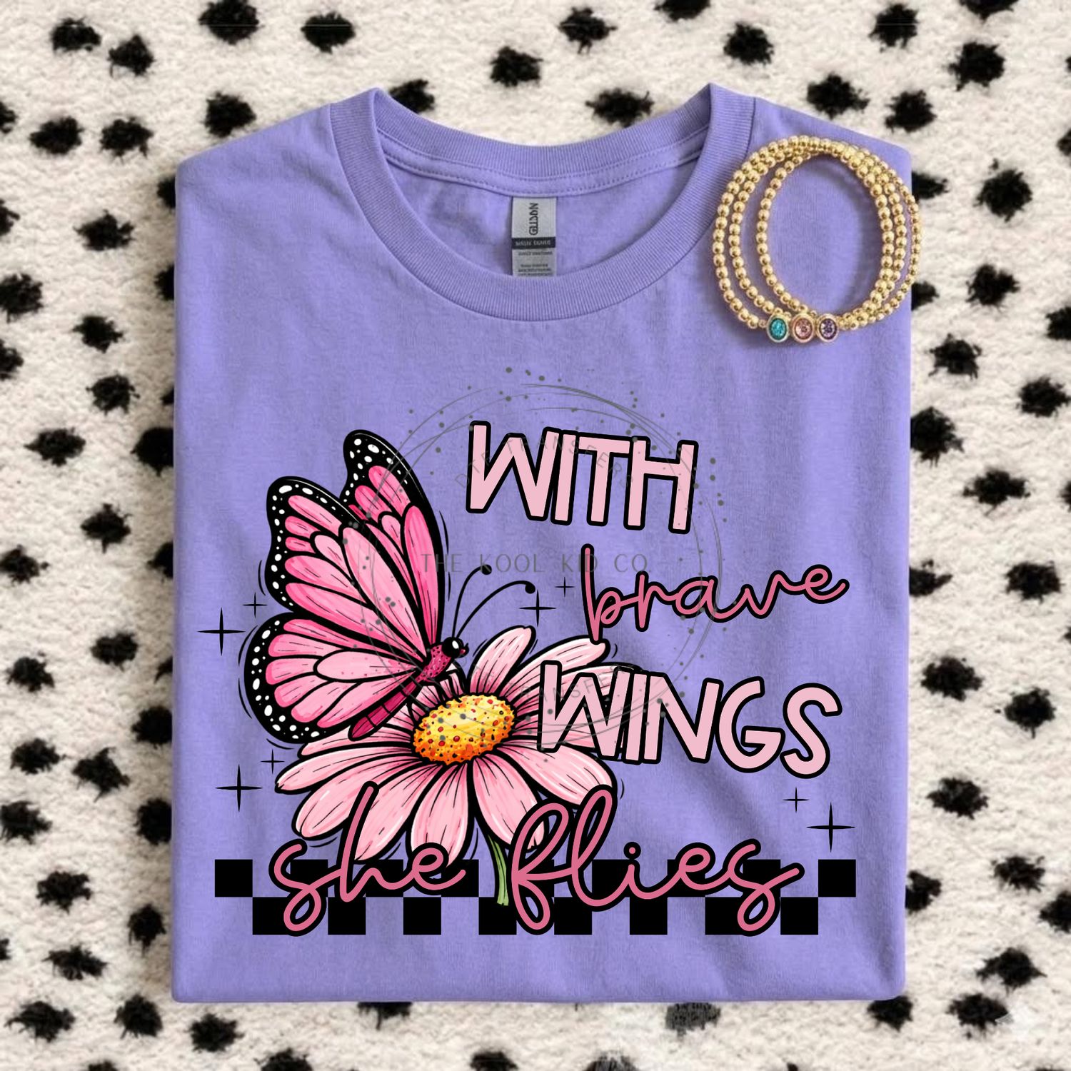 With Brave Wings She Flies