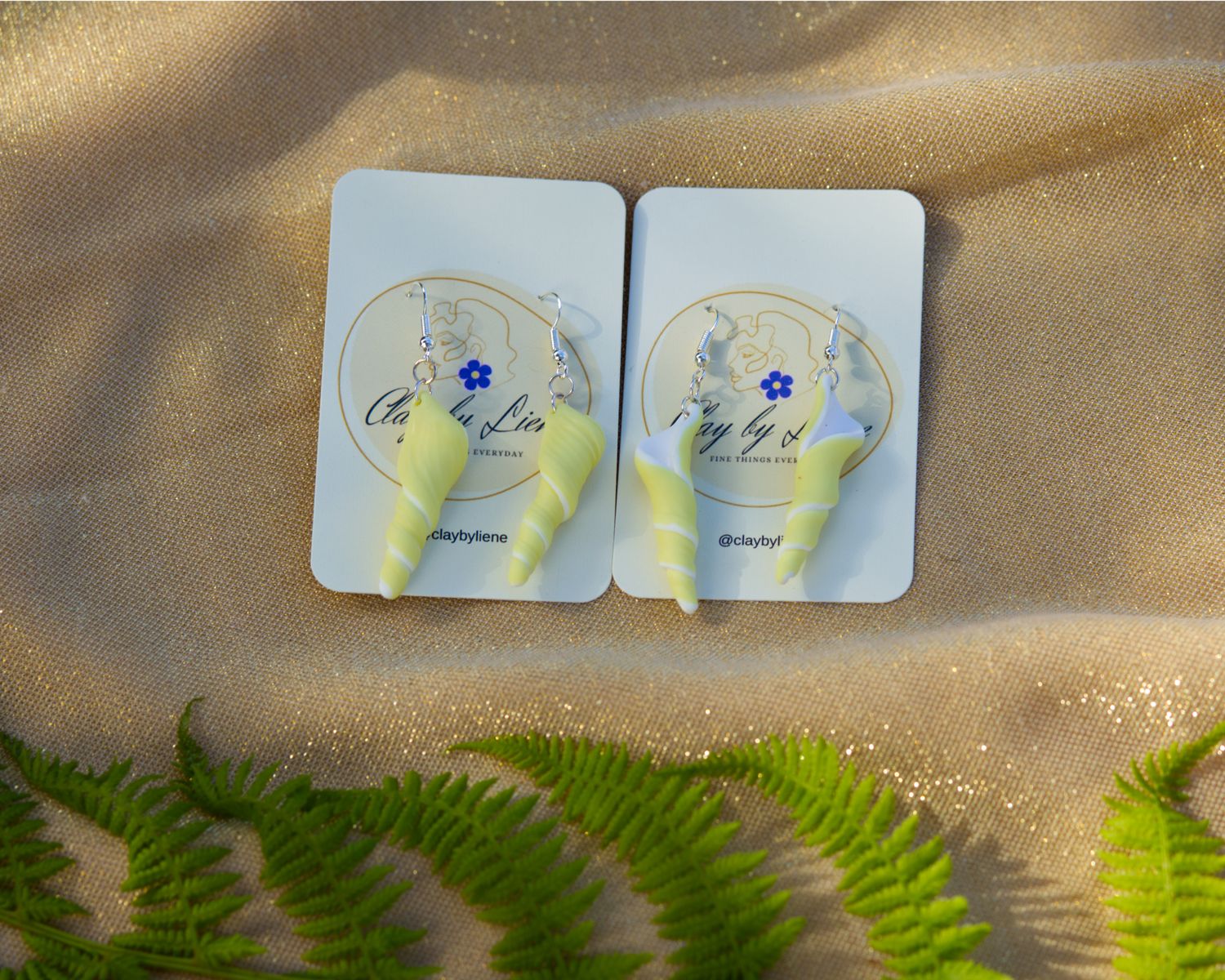 Long spiral sea shell/unicorn horn earrings