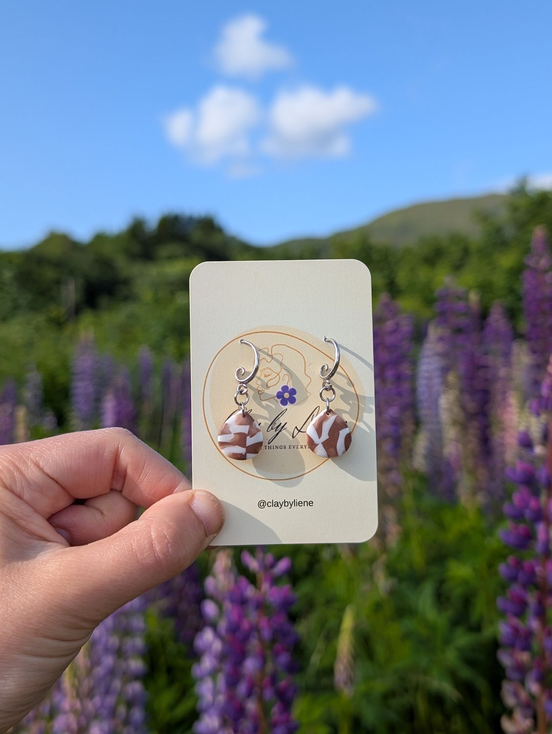White and brown drop earrings