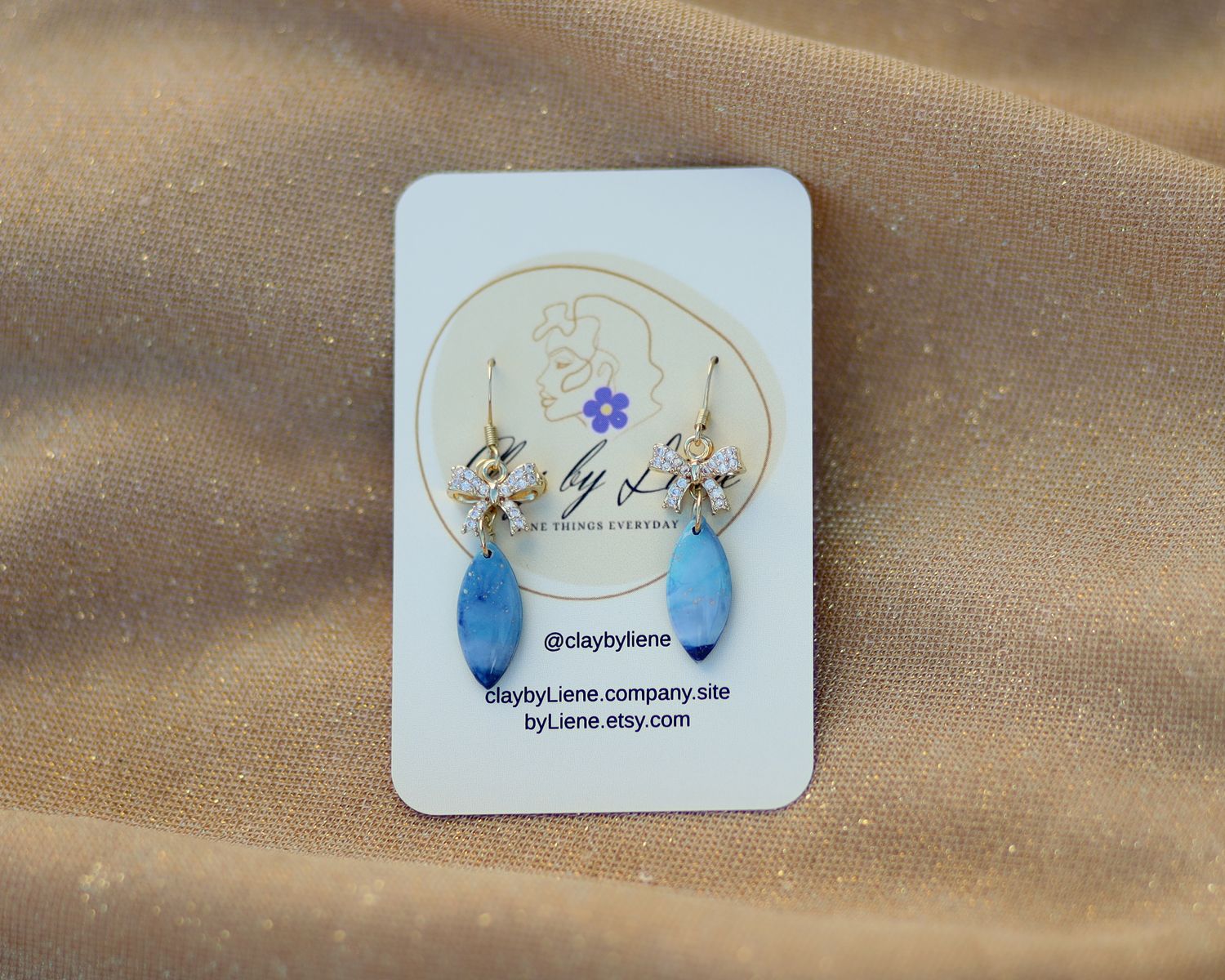 Winter dangle earrings with bow