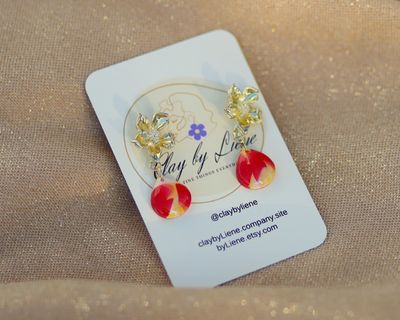 Drop earrings with gold plated flower stud