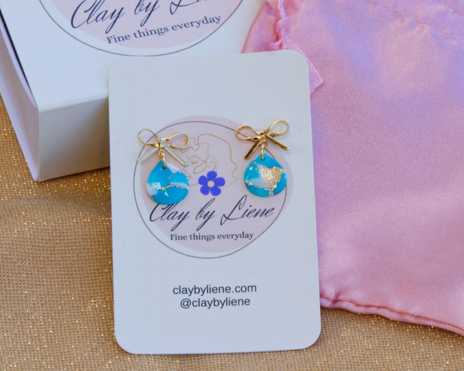 Cozy bow drop earrings