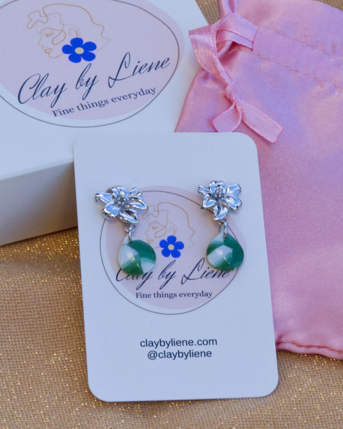 Green drop earrings with flower studs