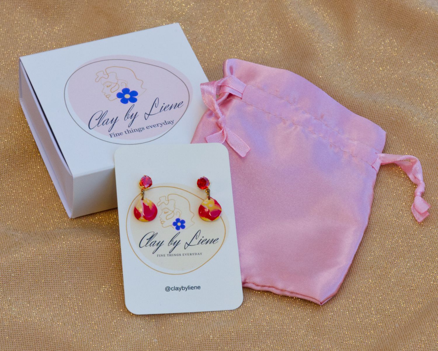 Small drop earrings with orange zirconia stone