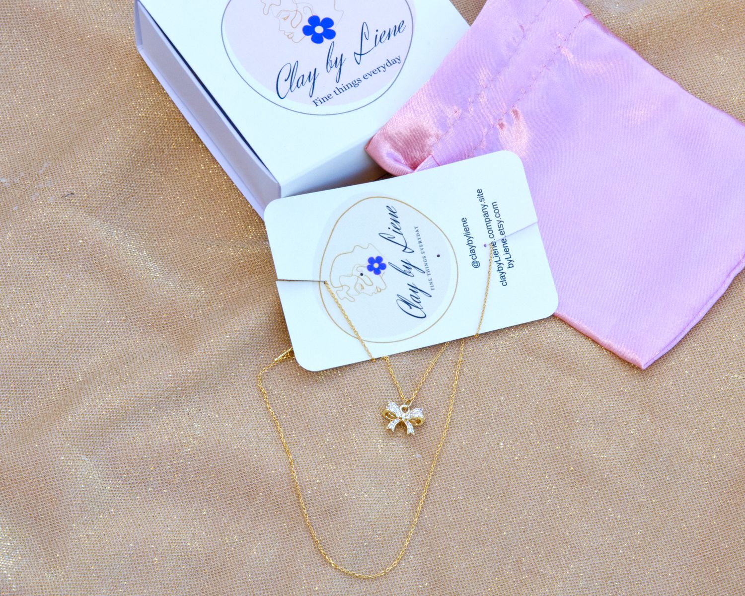 Gold plated silver necklace with bow charm