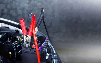 Portable car inverter connected with multiple cables inside vehicle