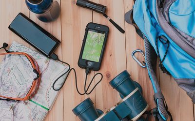 Power bank and charging accessories arranged neatly with smartphone on desk