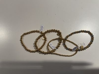 Dunne armbandjes met gouden bollen