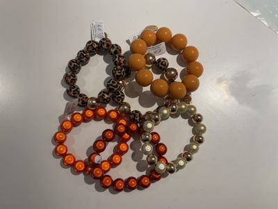 Bollen armbanden (leo, okergeel, oranje en bleek met goud)