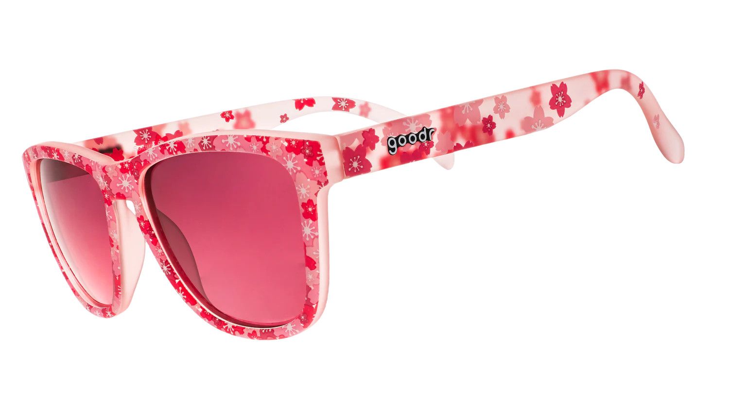 Goodr Sakura Showtime OG Sunglasses with pale pink frames, non-reflective light red lenses, and a cherry blossom-inspired floral design.