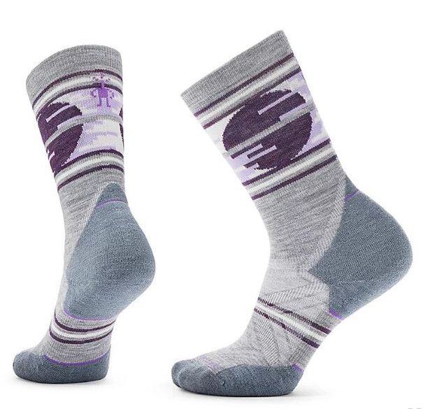 Smartwool women&#39;s merino wool trail running crew sock with cushioning in light gray.