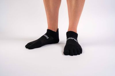 Black merino wool low ankle toe socks with heel tab and anatomical fit