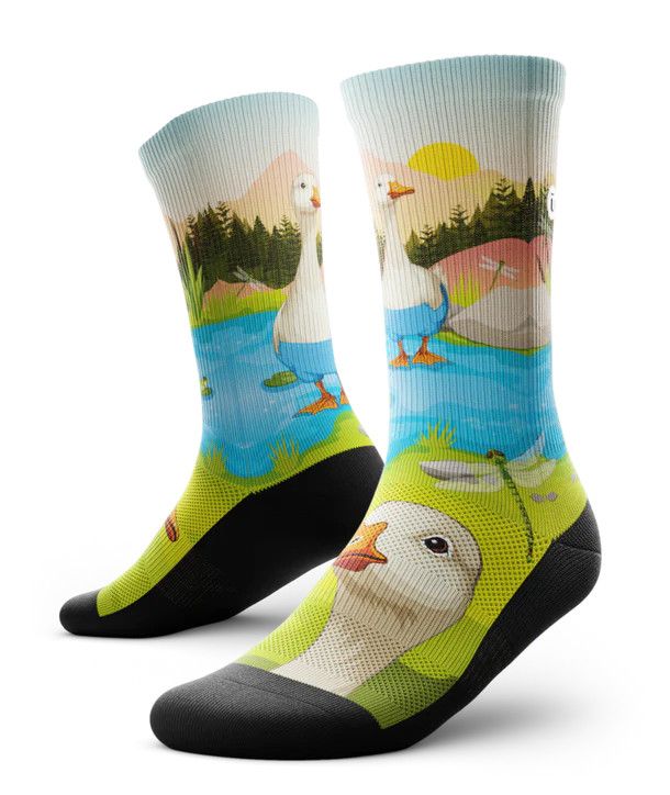 Performance crew socks with relaxed duck print, breathable mesh zones, and arch support.

