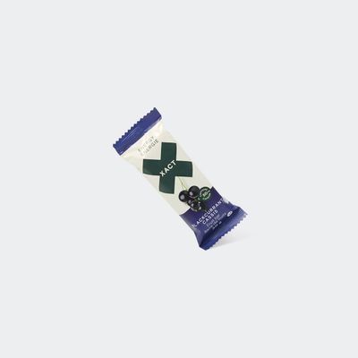 Blackcurrant XACT Energy Fruit Bar in wrapper, showcasing soft fruit-based texture.