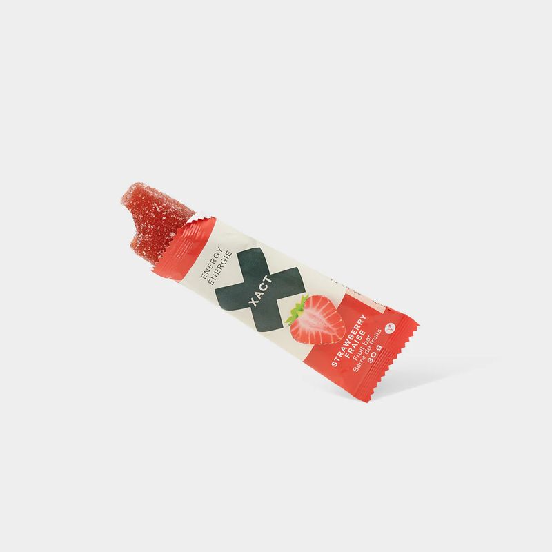 Strawberry XACT Energy Fruit Bar in bright red wrapper, showing soft, fruit-based chew texture.