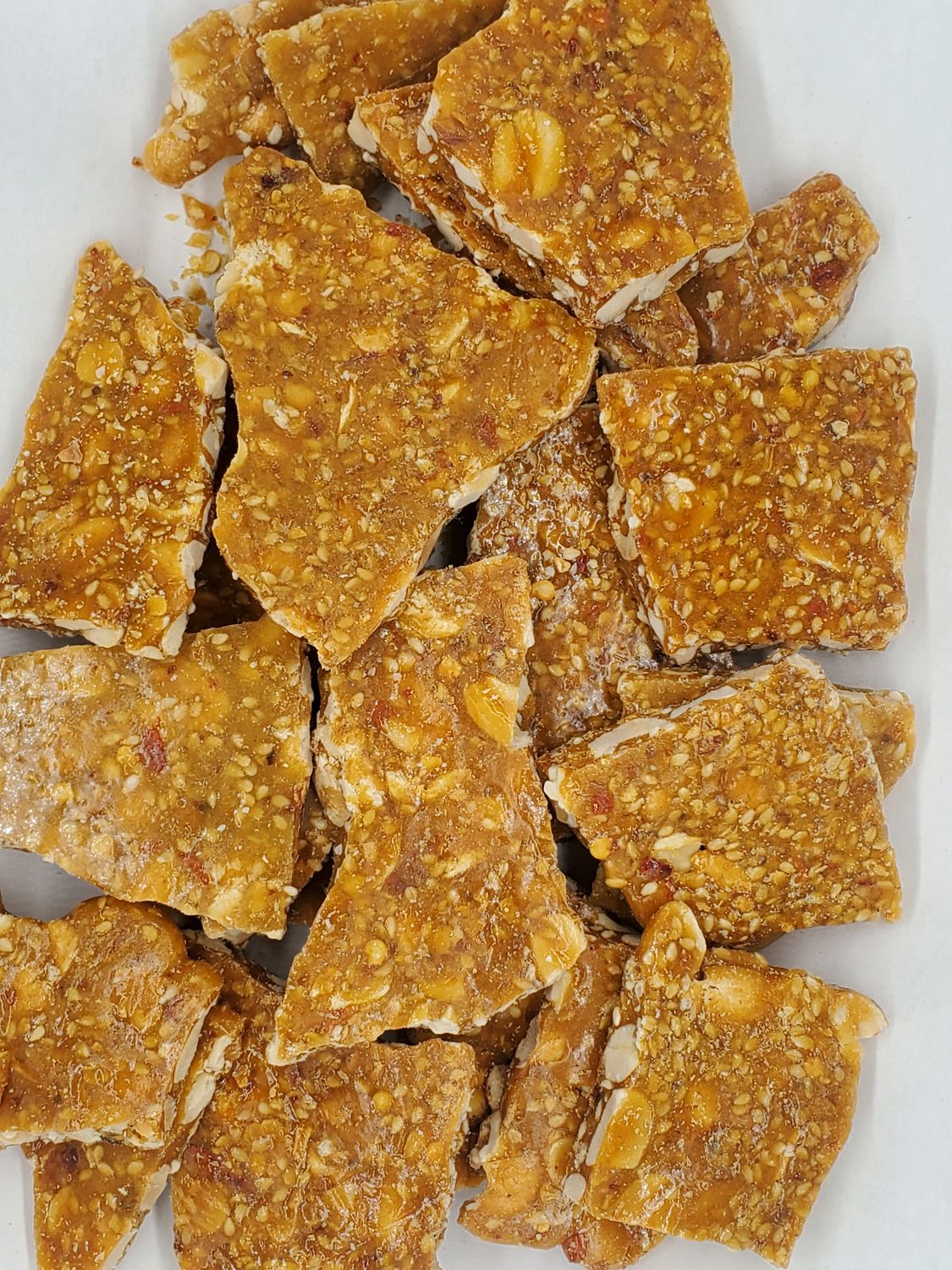 Spicy Chili Crisp Peanut Brittle Candy, Old Fashioned Style Brittle with a Sweet and Spicy Flavor of Chinese Chili Crisp, Vegan and Gluten Free, 4 Ounce Bag Spicy Chili Crisp Peanut Brittle Candy, Old Fashioned Style Brittle with a Sweet and Spicy Flavor of Chinese Chili Crisp, Vegan and Gluten Free, 4 Ounce Bag