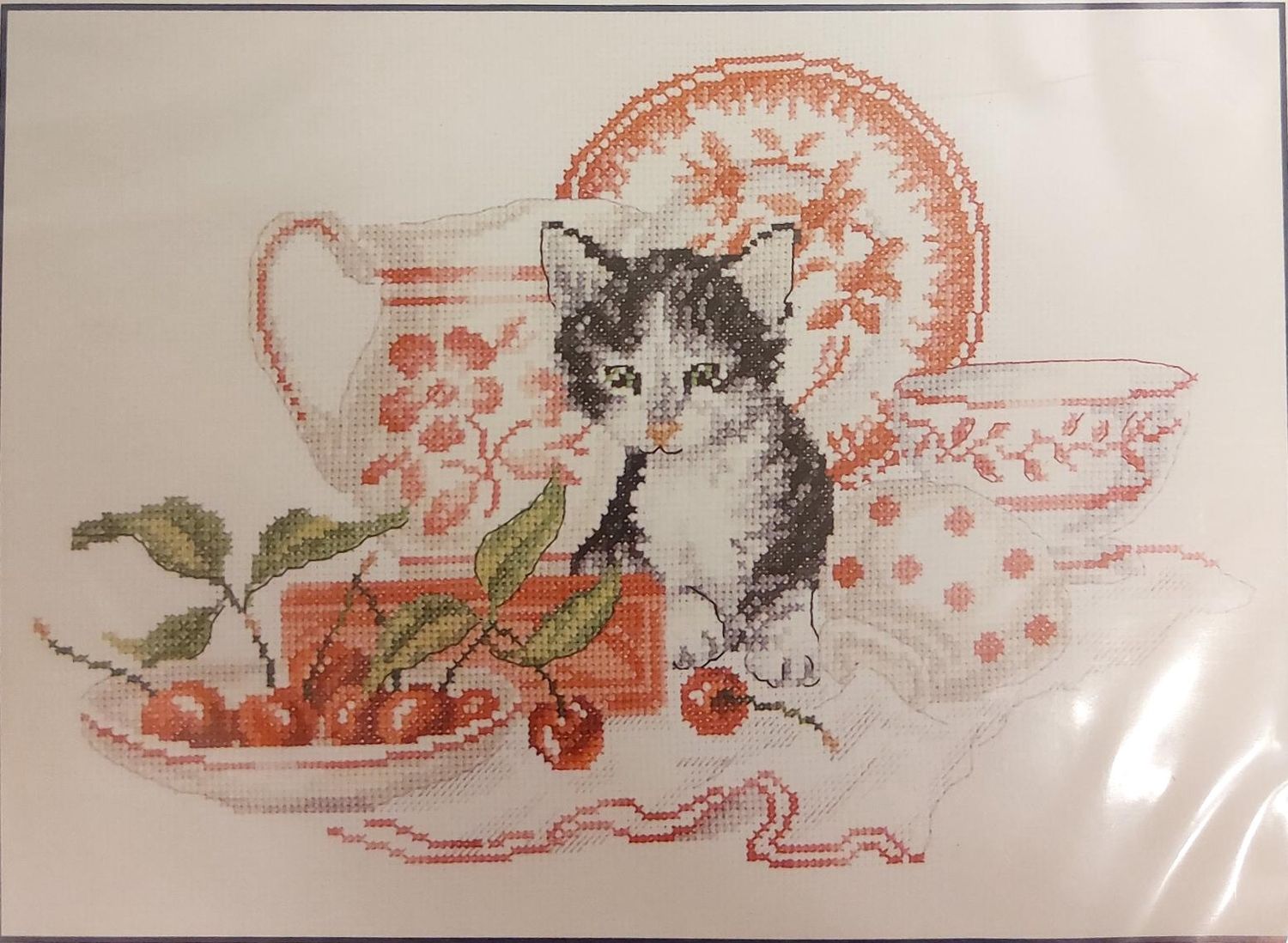 The kitten and cherries