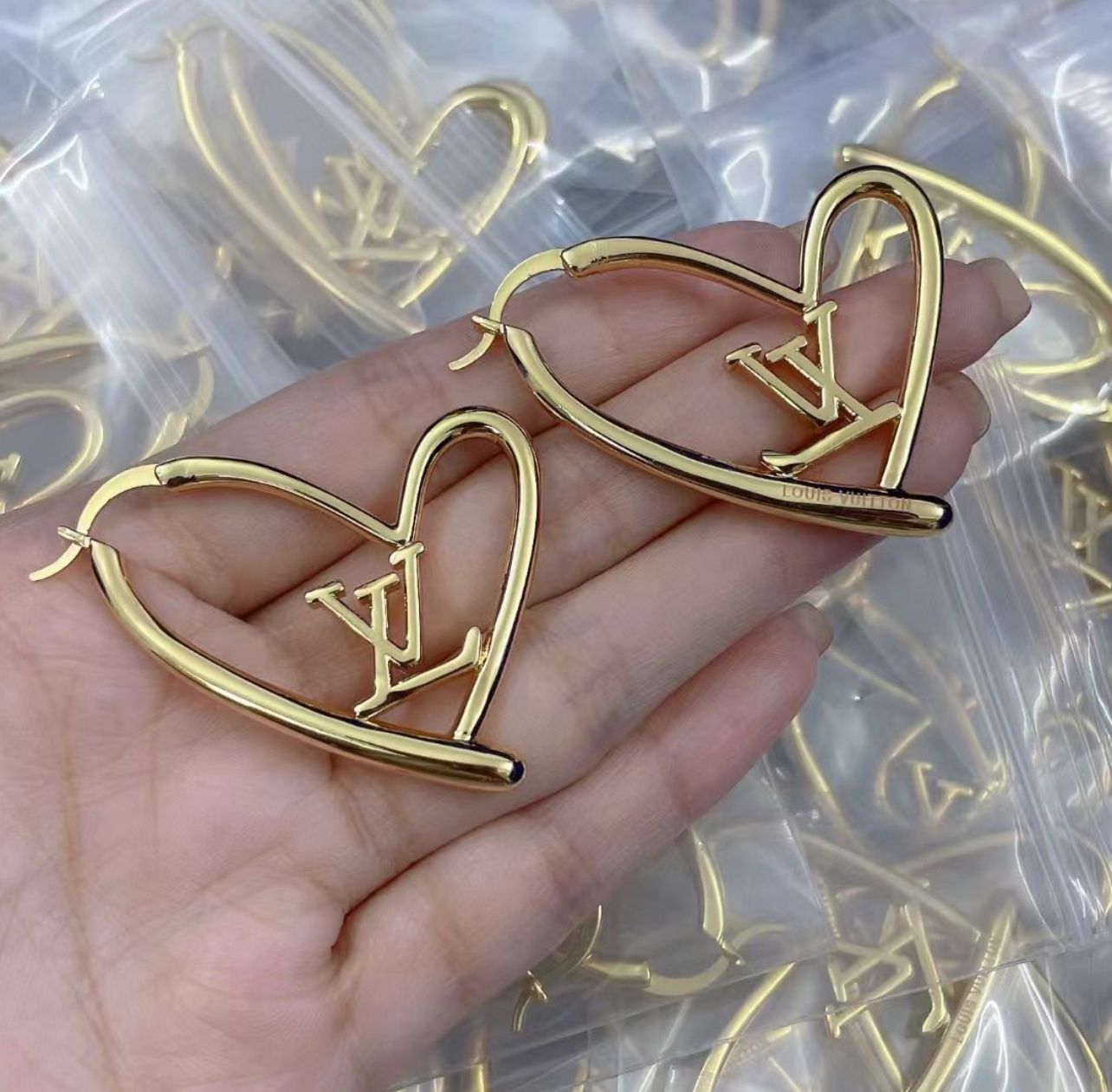 L gold heart earrings