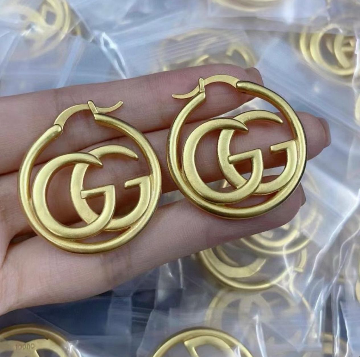 GG gold hoop earrings