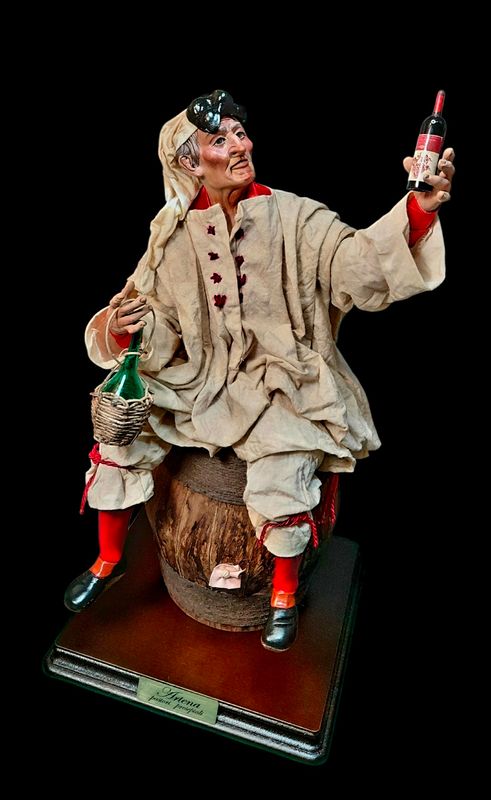 Pulcinella on a wine barrel, size 32 cm