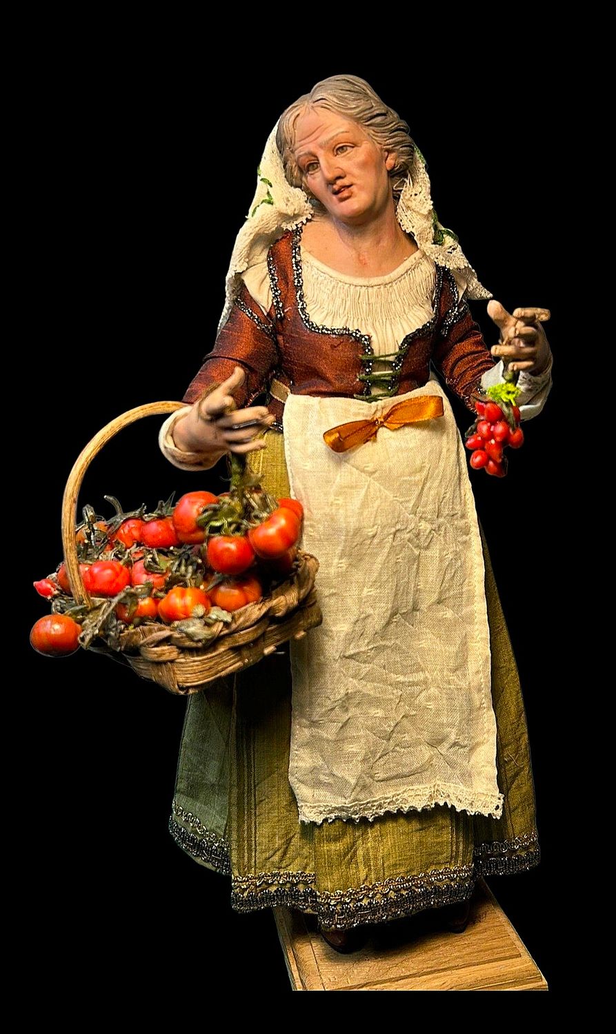 A commoner selling tomatoes - a figure from an 18th-century Neapolitan nativity scene.