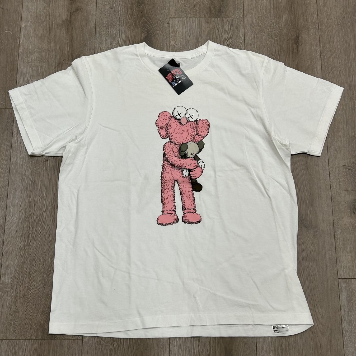 KAWS x Uniqlo Pink BFF Tee - Pre-Owned, Clothing Size: XL, Product Condition: Pre-Owned