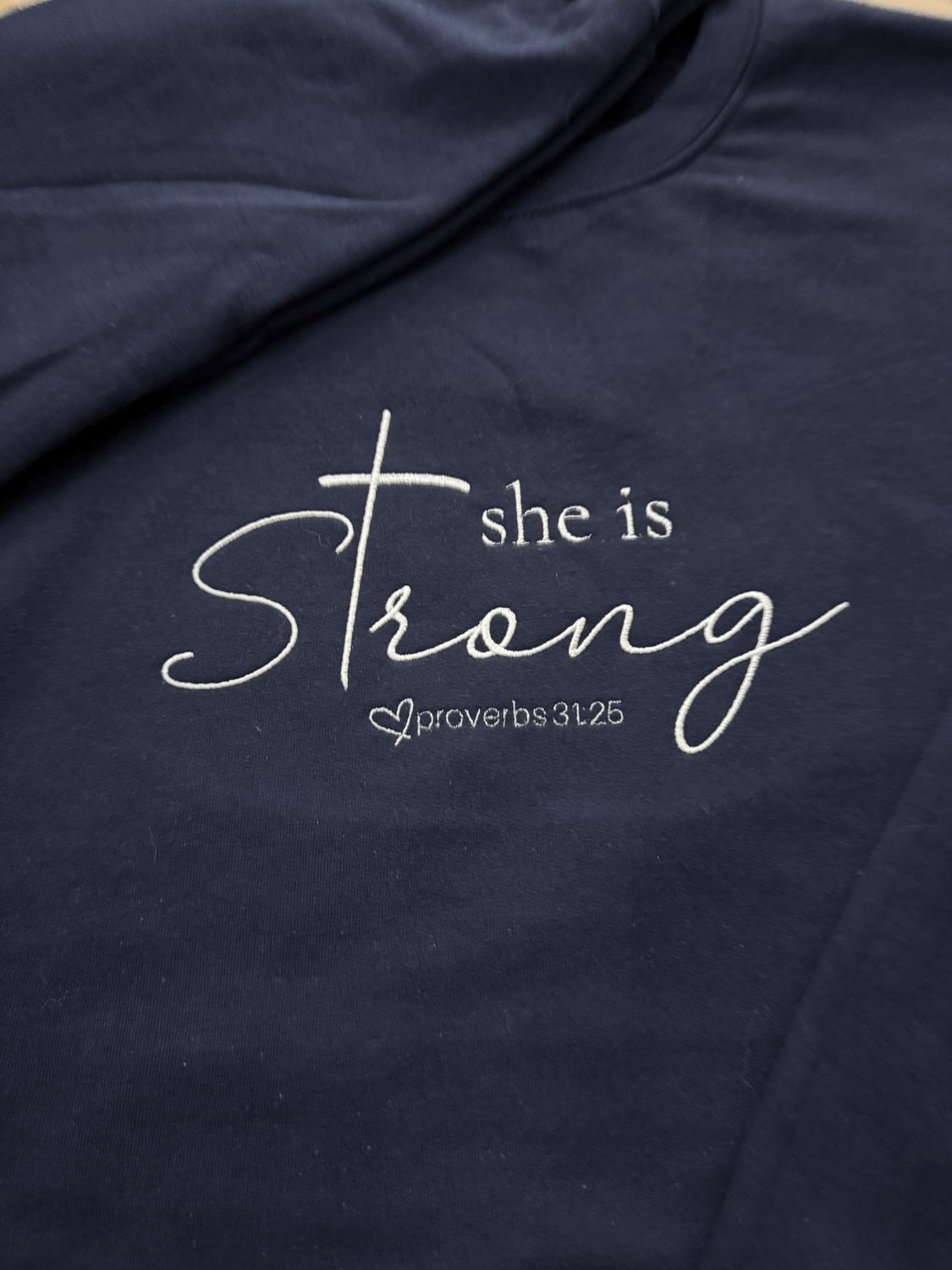 She Is Strong – Proverbs 31:25 Embroidered Faith Apparel