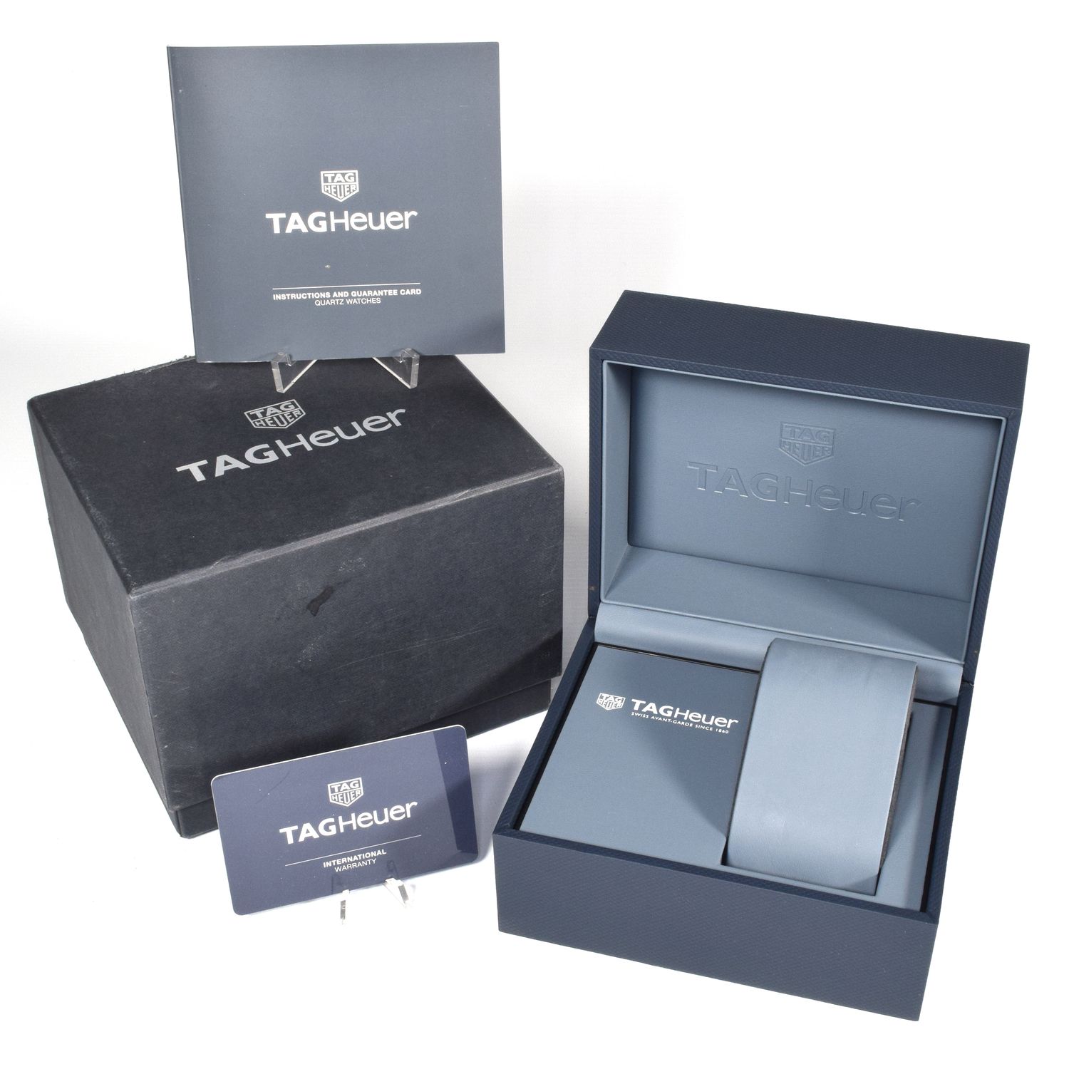 TAG Heuer Formula 1 watch case set including branded storage box, display box, instruction booklet, and international warranty card
