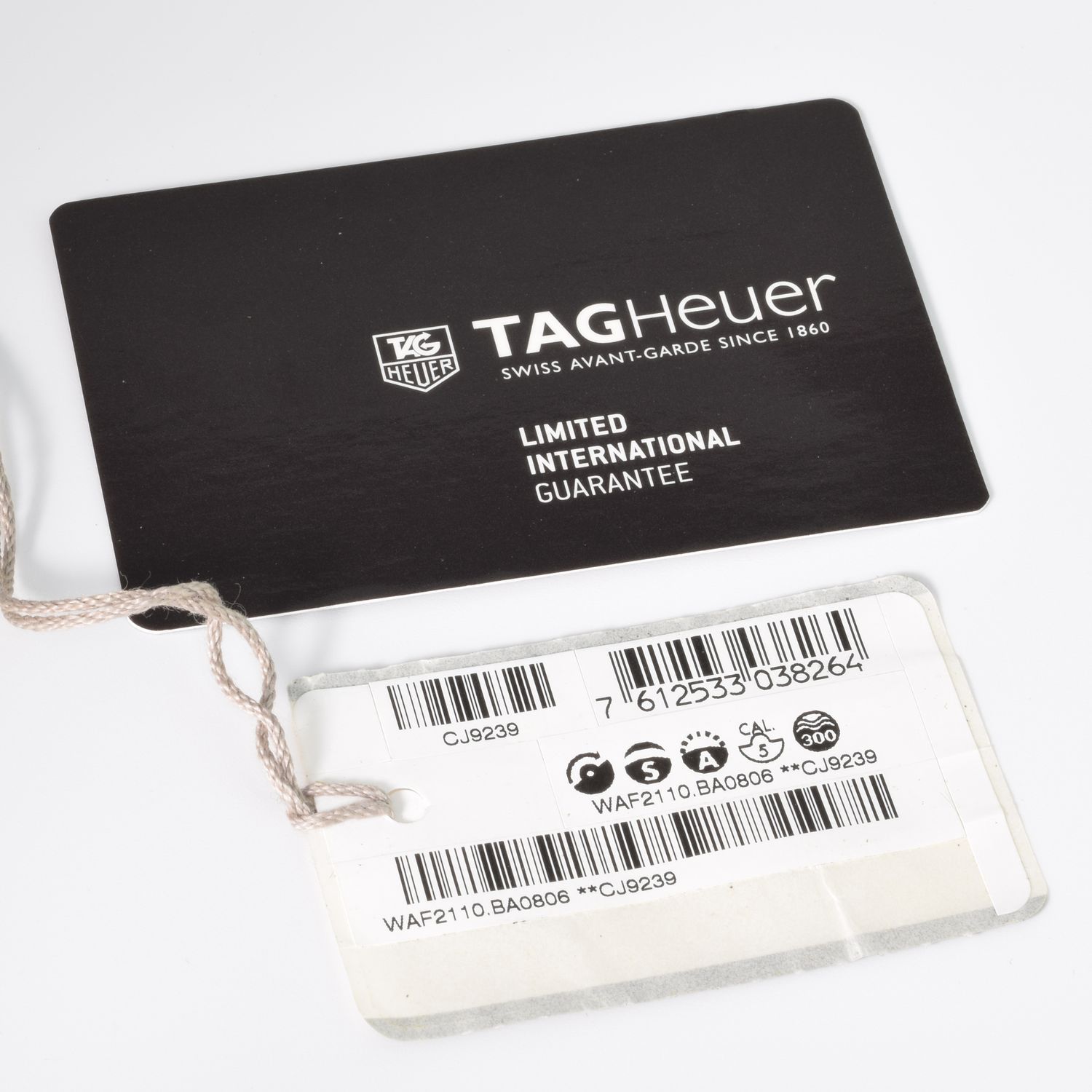 TAG Heuer Aquaracer WAF2110.BA0806 limited international guarantee card and swing tag with barcode and reference numbers
