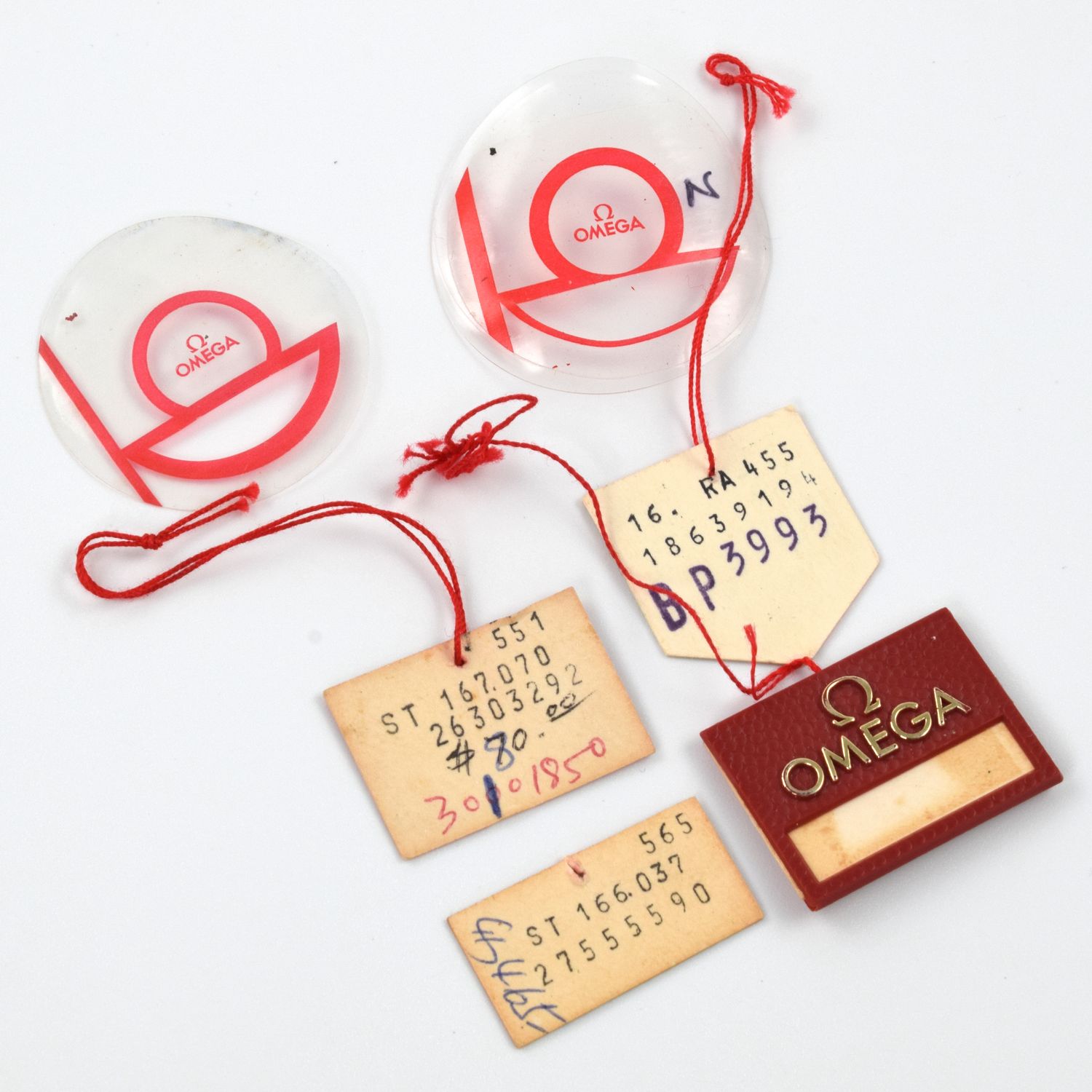 Omega vintage watch tags and caseback protection film set with red string – original accessories for classic timepieces