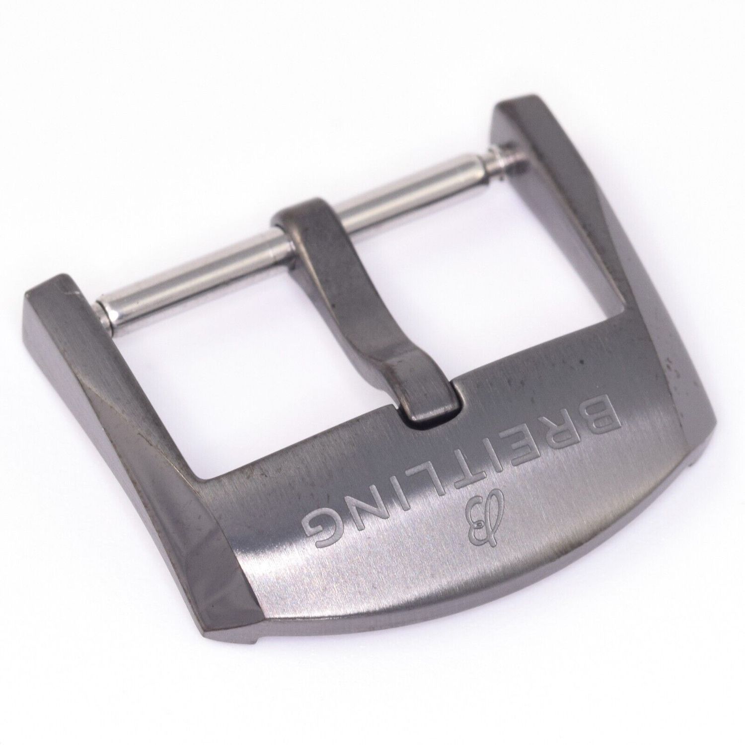 Genuine Breitling Navitimer black PVD-coated stainless steel tang buckle clasp, engraved with logo and model M18BASA.6, shown in used condition