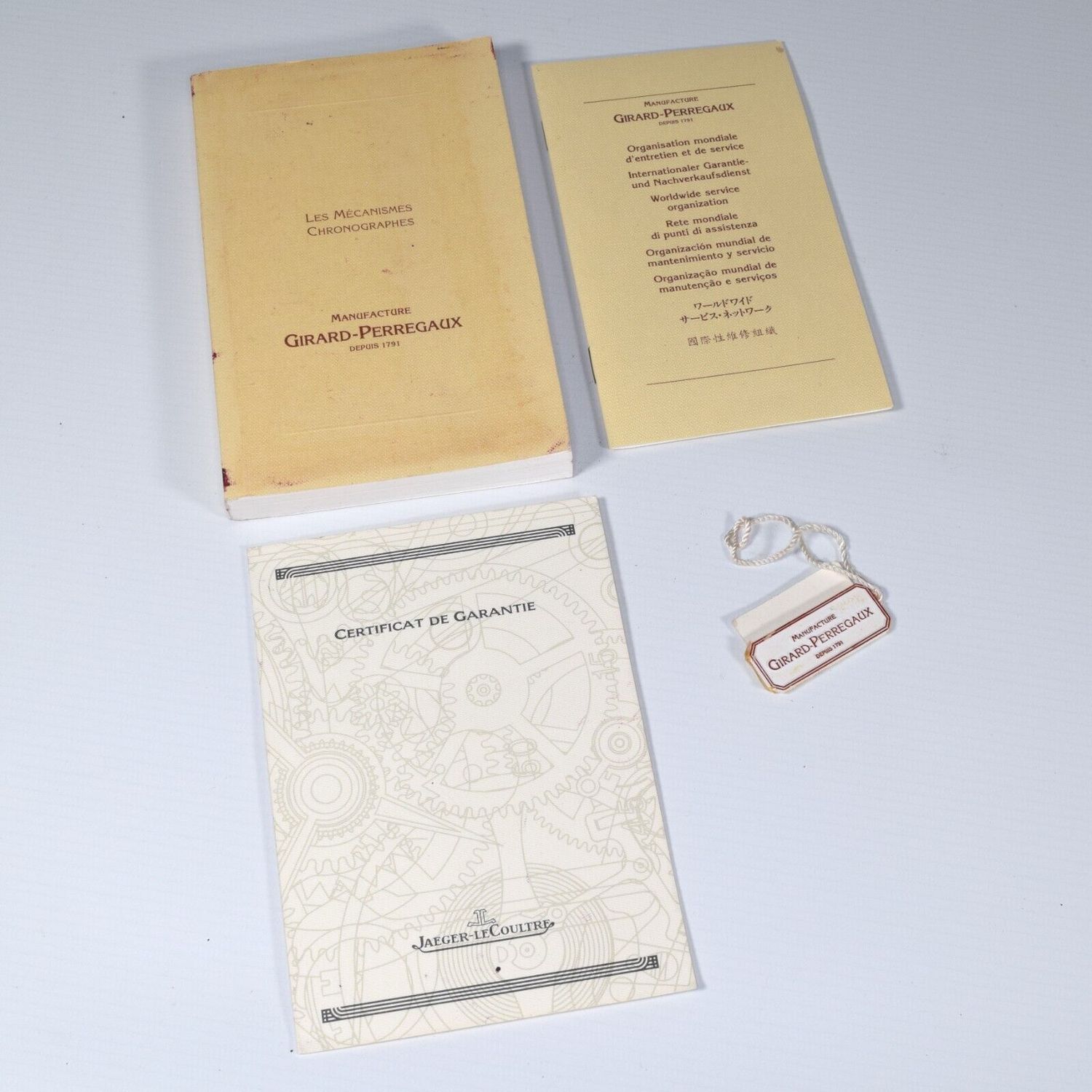 Girard-Perregaux 77000 Chronograph watch documents with manuals, warranty certificate and branded hang tag from 1998