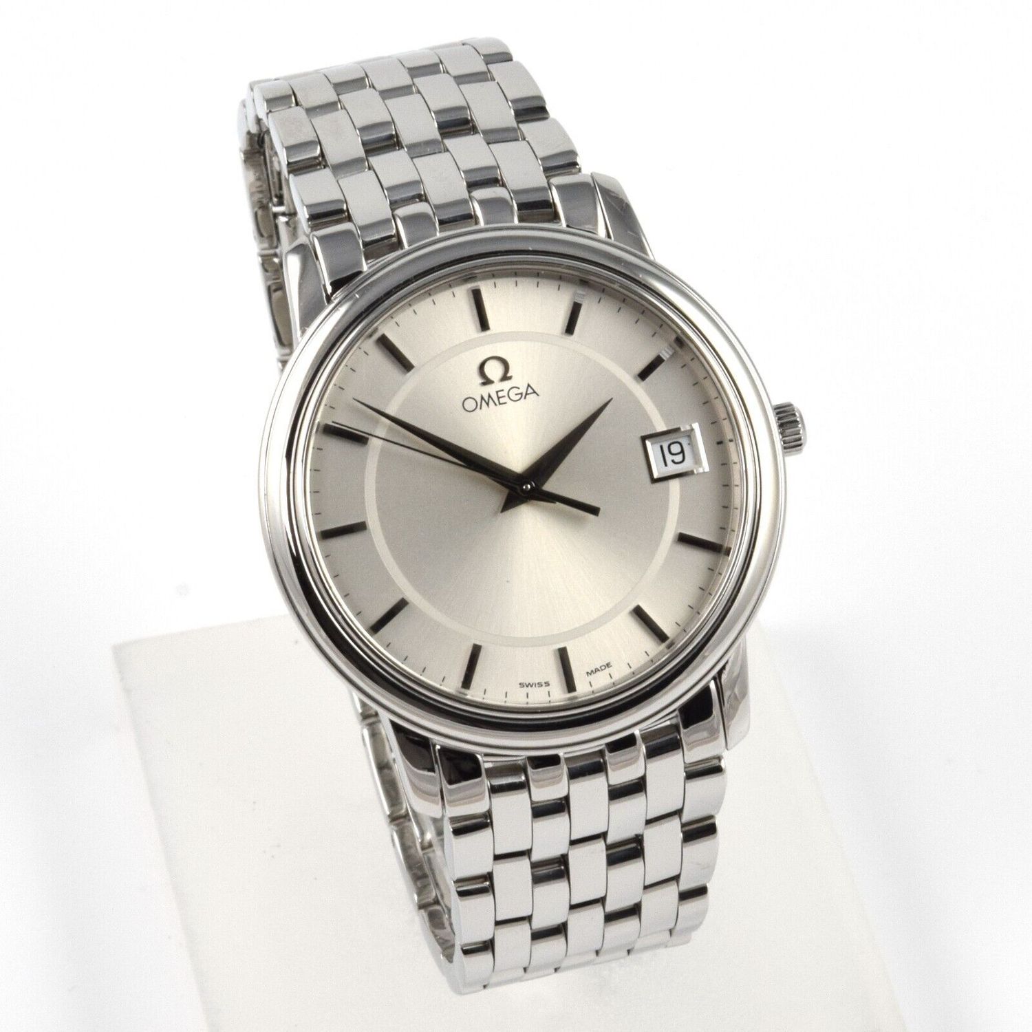 Omega De Ville Quartz 34.4mm men’s stainless steel wristwatch with silver dial, date display, Caliber 1532 movement and polished multi-link bracelet displayed upright without service box