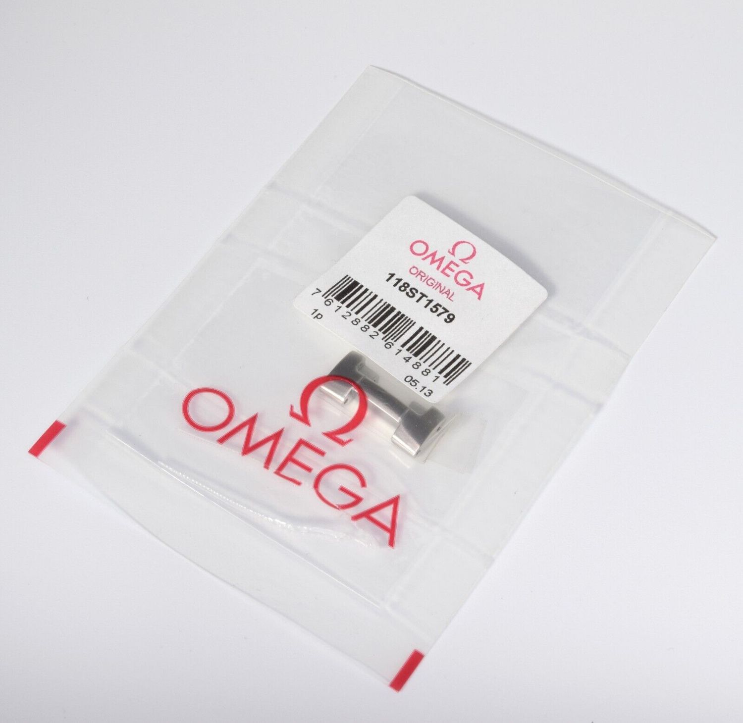 Omega 118ST1579 clasp end link adaptor for Planet Ocean, 20mm wide, shown sealed in original Omega packaging