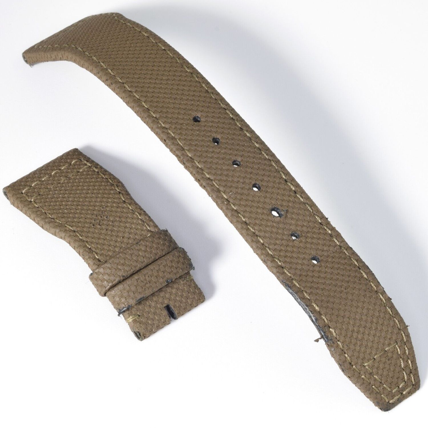 IWC Pilot’s watch strap in green textile with leather backing, featuring 21mm lug width tapering to 18mm at the buckle