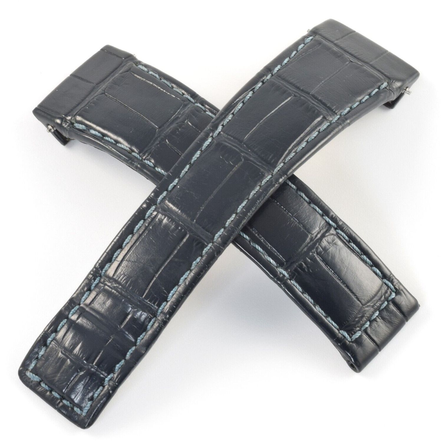 TAG Heuer Monaco Twenty Four Calibre 36 blue alligator leather watch strap with light blue stitching, showing both parts crossed and laid flat