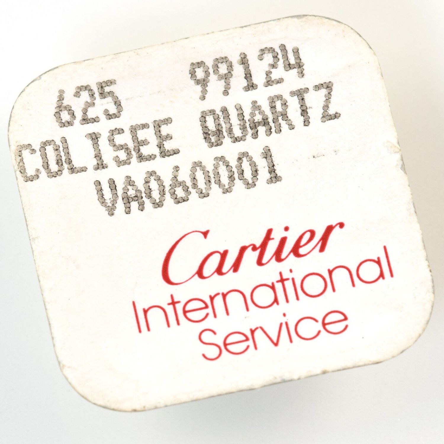Original Cartier International Service packaging for Colisee Quartz model showing printed text 625, 99124, COLISEE QUARTZ, VA060001 in black and red, confirming contents are gold plated lug screws