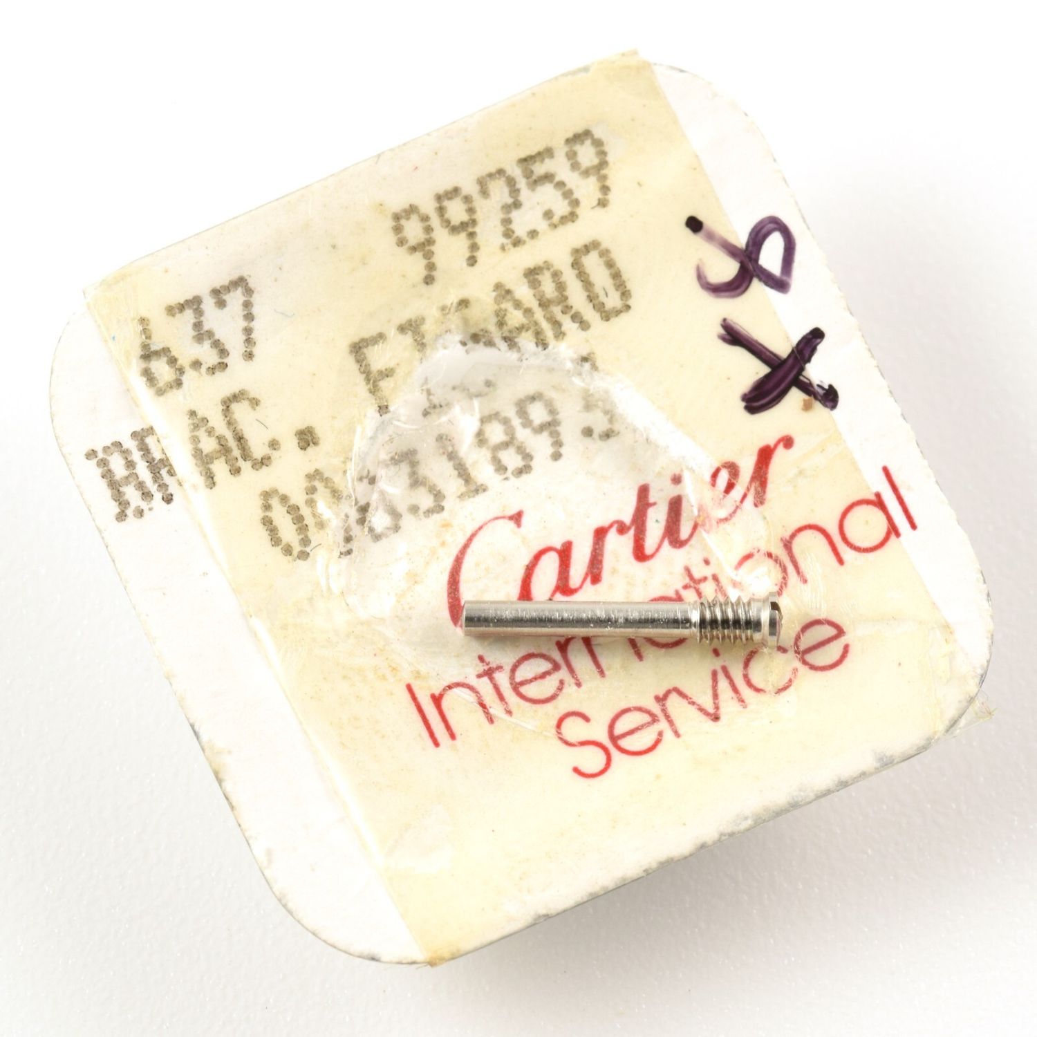 Single authentic Cartier Panthere clasp attachment screw part number 00831893 made from steel shown on original Cartier International Service packaging with visible printed text including 637, 99259, BRAC FIGARO and 00831893