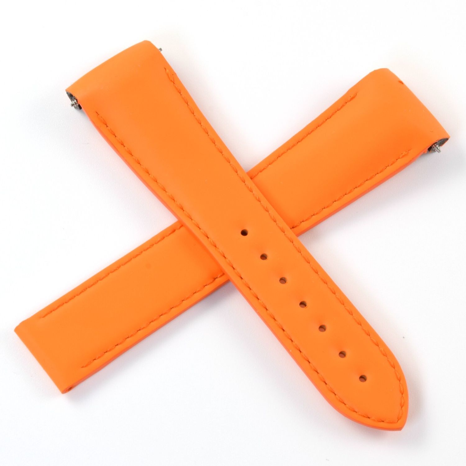 Orange Omega Planet Ocean 45.5mm rubber watch strap with visible stitching and multiple sizing holes, showing both strap pieces crossed over each other