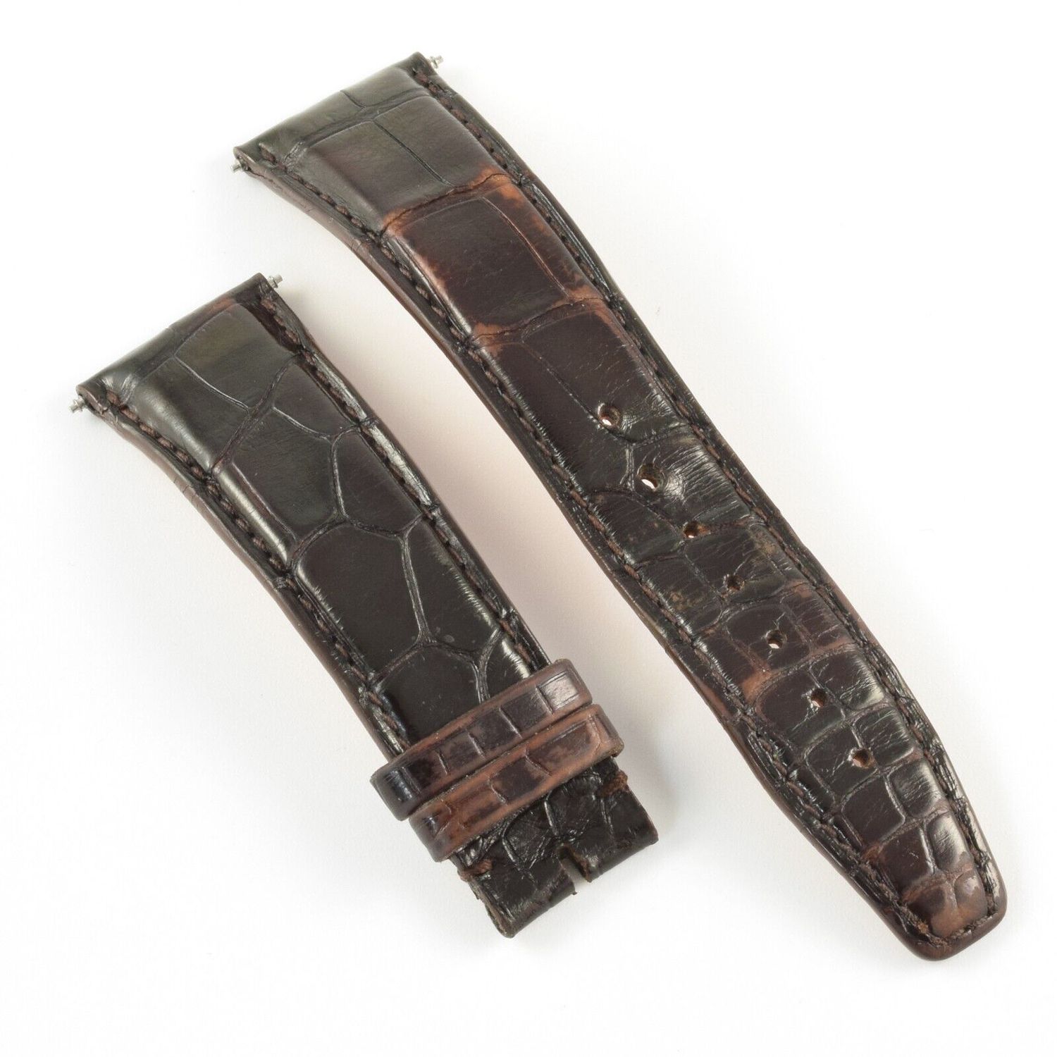 IWC Portofino dark brown alligator leather watch strap with curved padding, visible stitching and a leather keeper loop on the short side