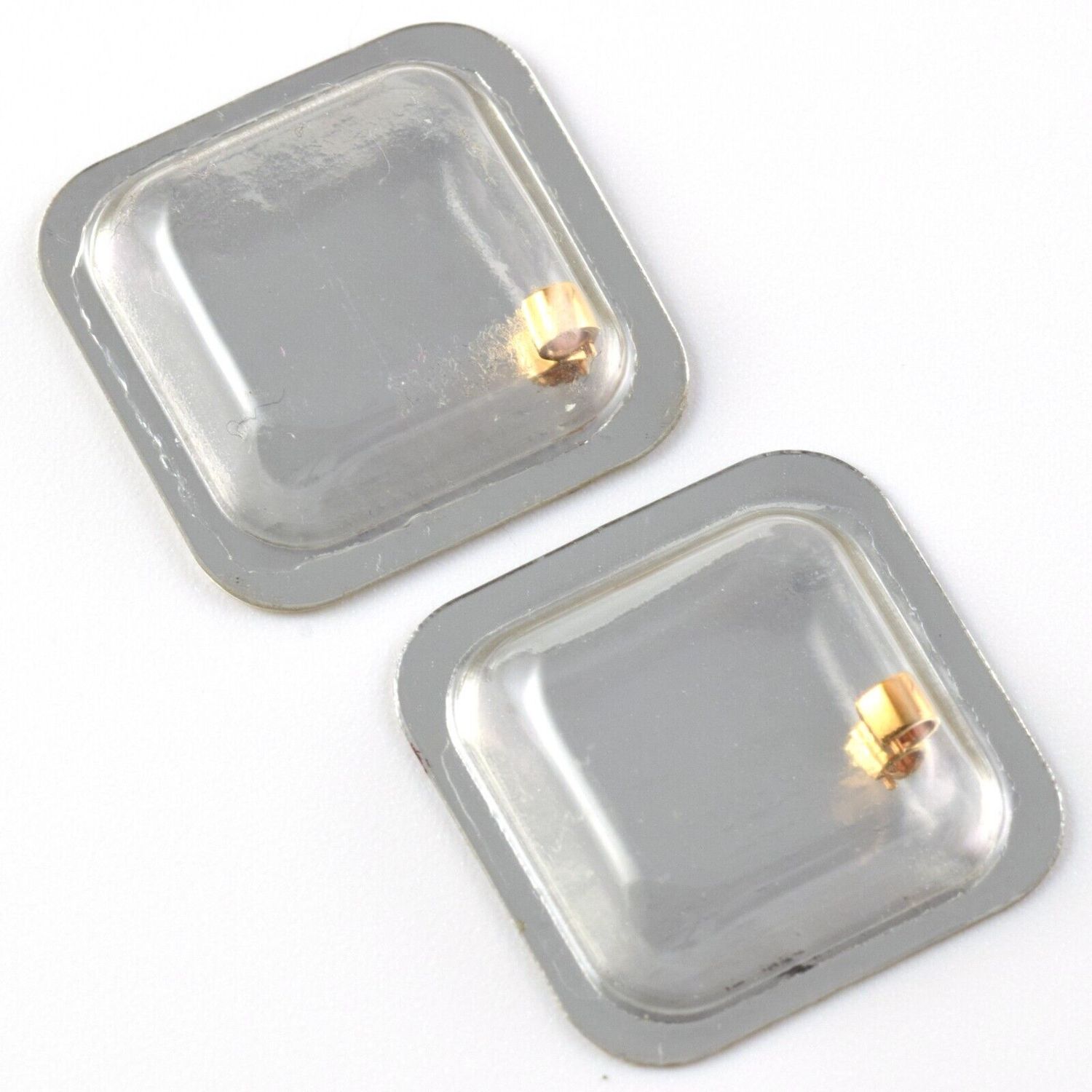 wo sealed blister packs each containing one round Cartier 18ct gold lug part for Panthère Vendôme ladies watch with brushed finish