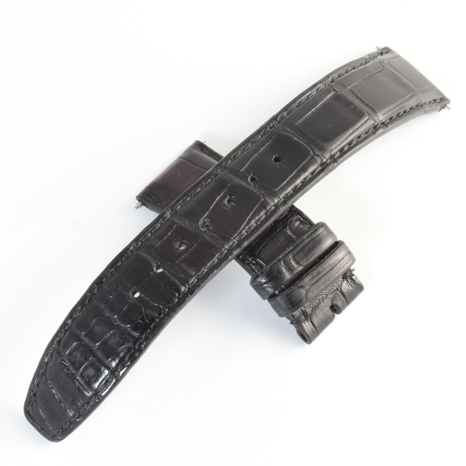 genuine black alligator IWC watch strap removed from Portugieser IW371404 with 20mm lug width and 18mm buckle end showing both strap pieces crossed on white background