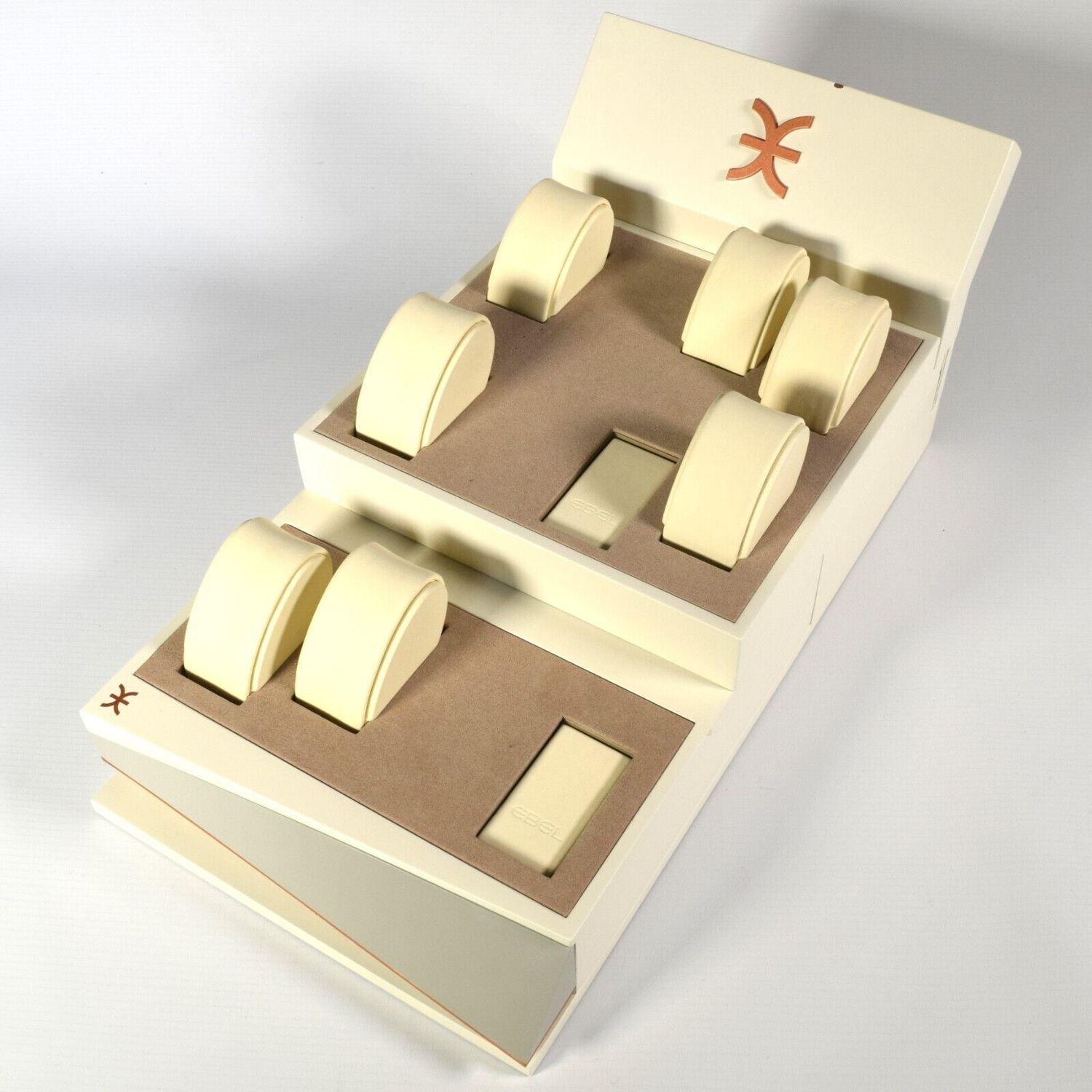 Authentic EBEL cream watch display stand with brown felt interior, 7 cream leather watch pillows, 2 EBEL-branded leather plugs and EBEL logo on top left and back panel