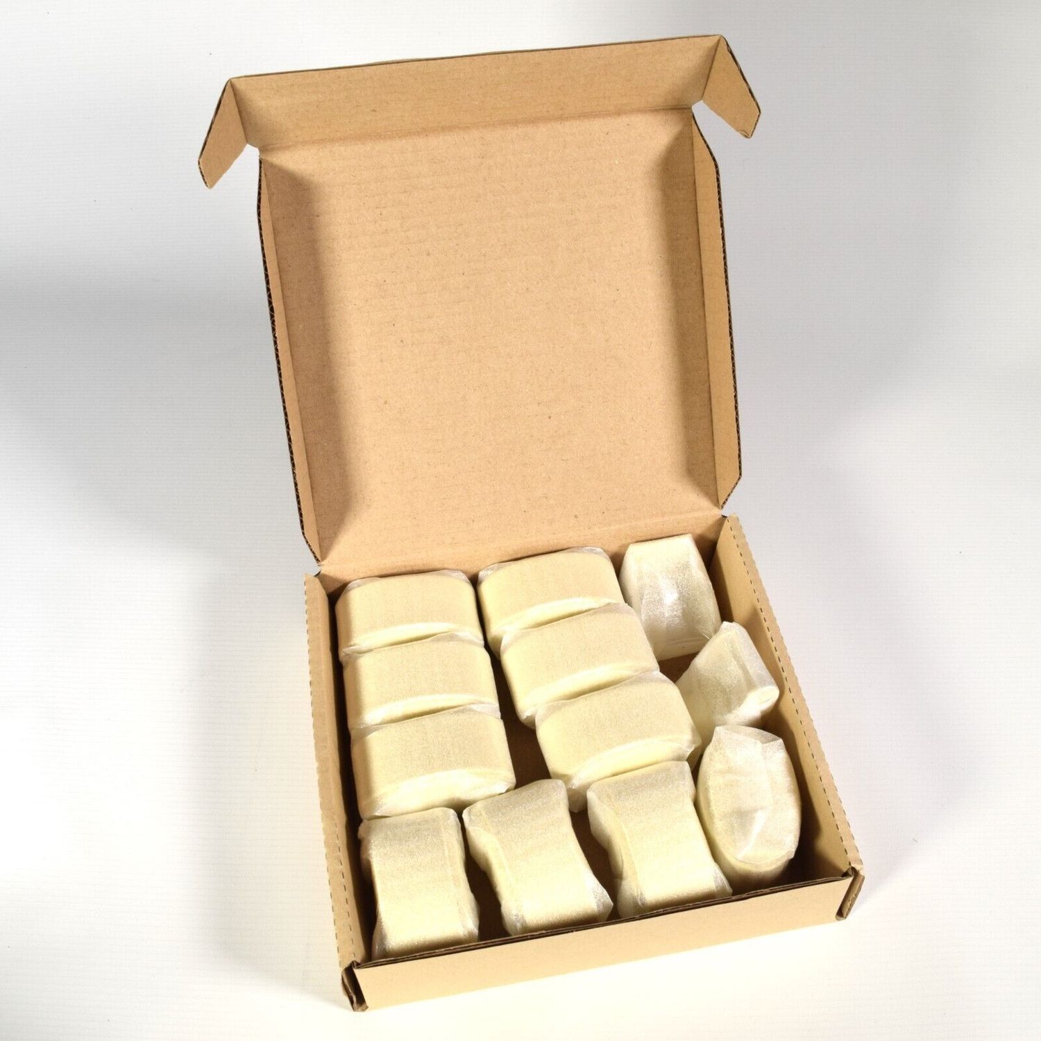Box of 10 new authentic EBEL cream leather cabochon watch holders with 2 display stands, individually wrapped in protective plastic
